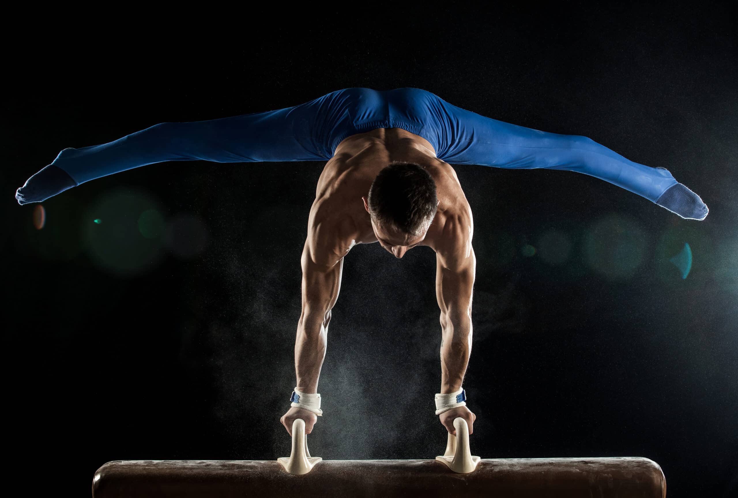 Male Gymnast doing handstand on Pommel Horse ©istock